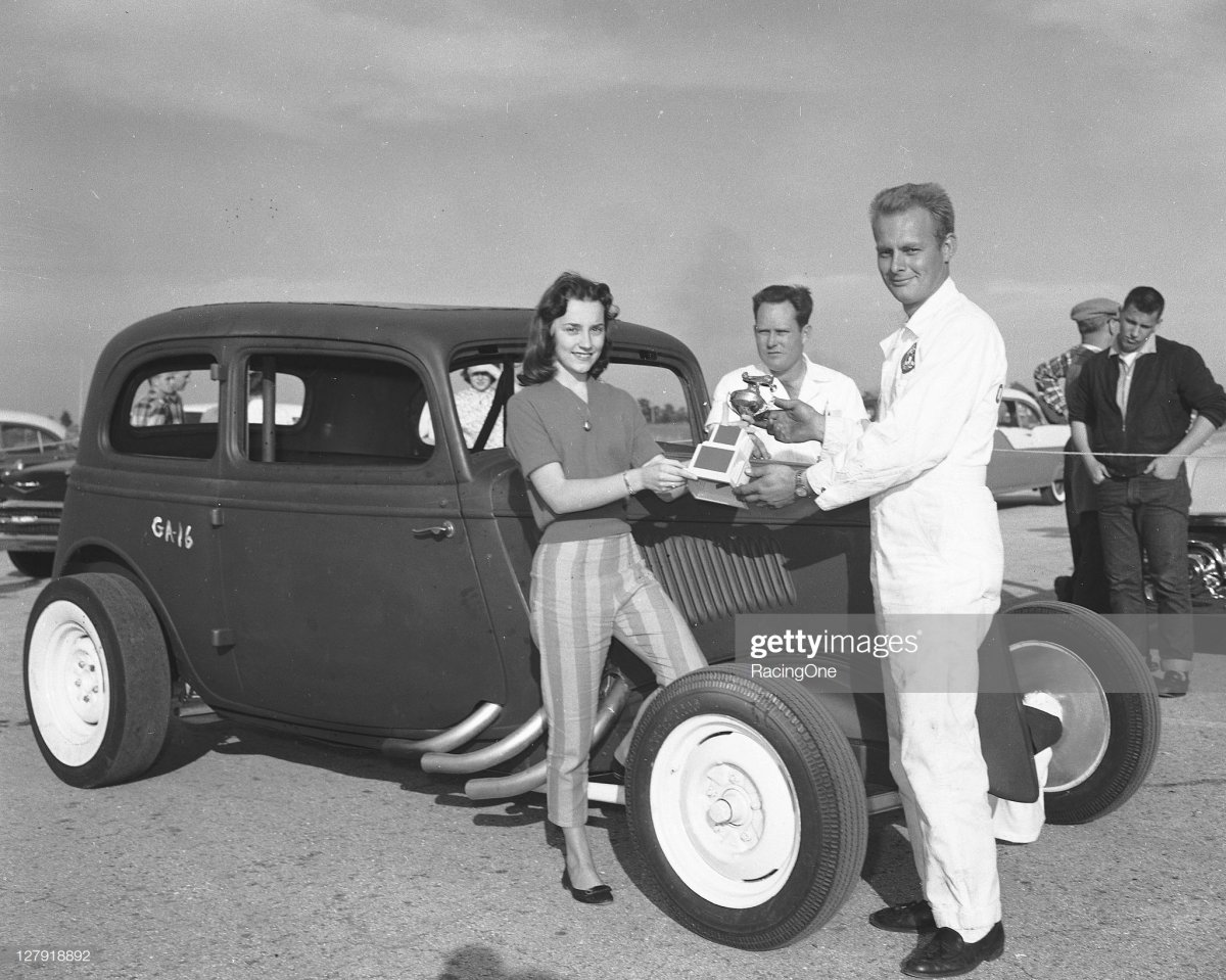 1 1958 Barbara Eutsler presents a trophy t.jpg