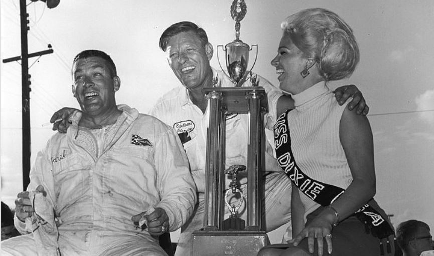 13 Darel Dieringer (L) is joined by car owner Bud Moore (C) and Miss Dixie USA.JPG