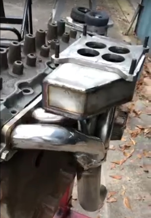 181 marine chevy motor sbc header and custom intake.jpg