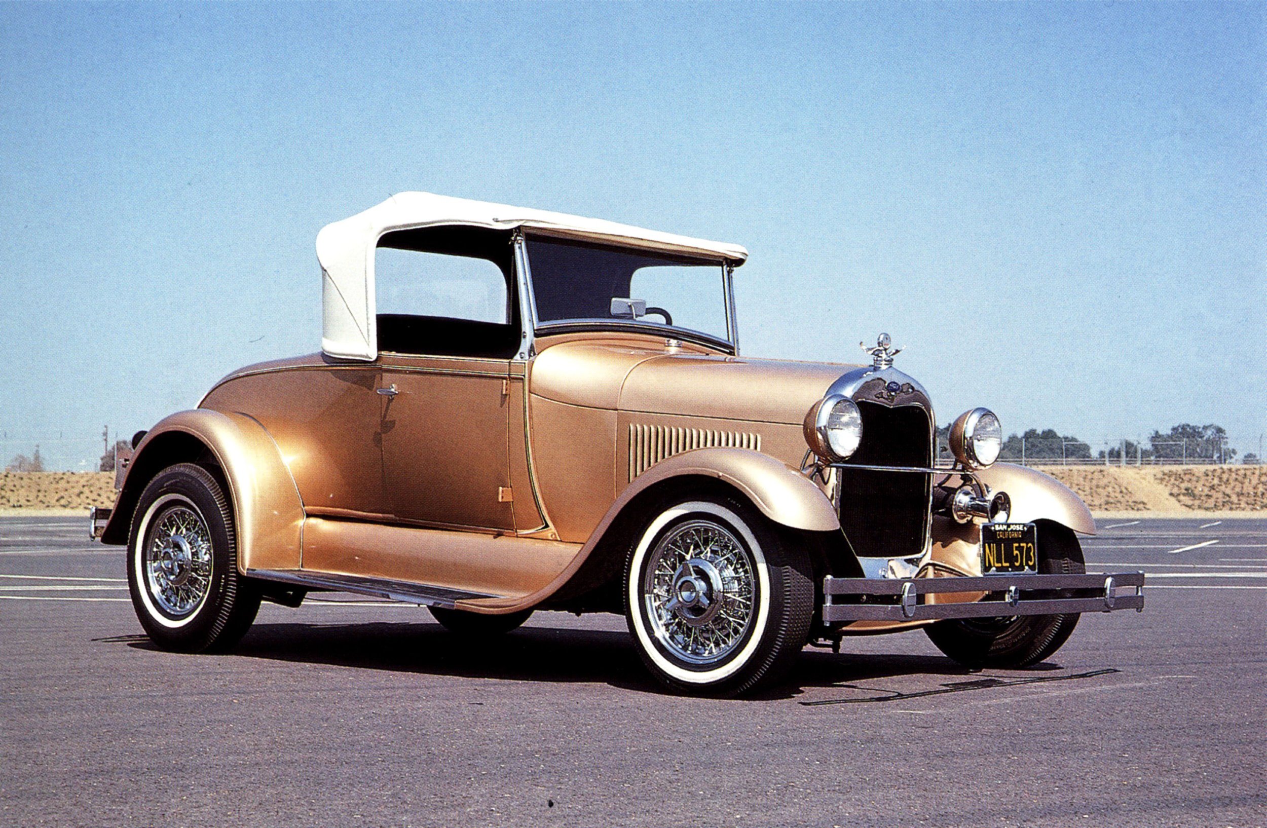 1929 Roadster in Gold with T-Bird Wires.jpg