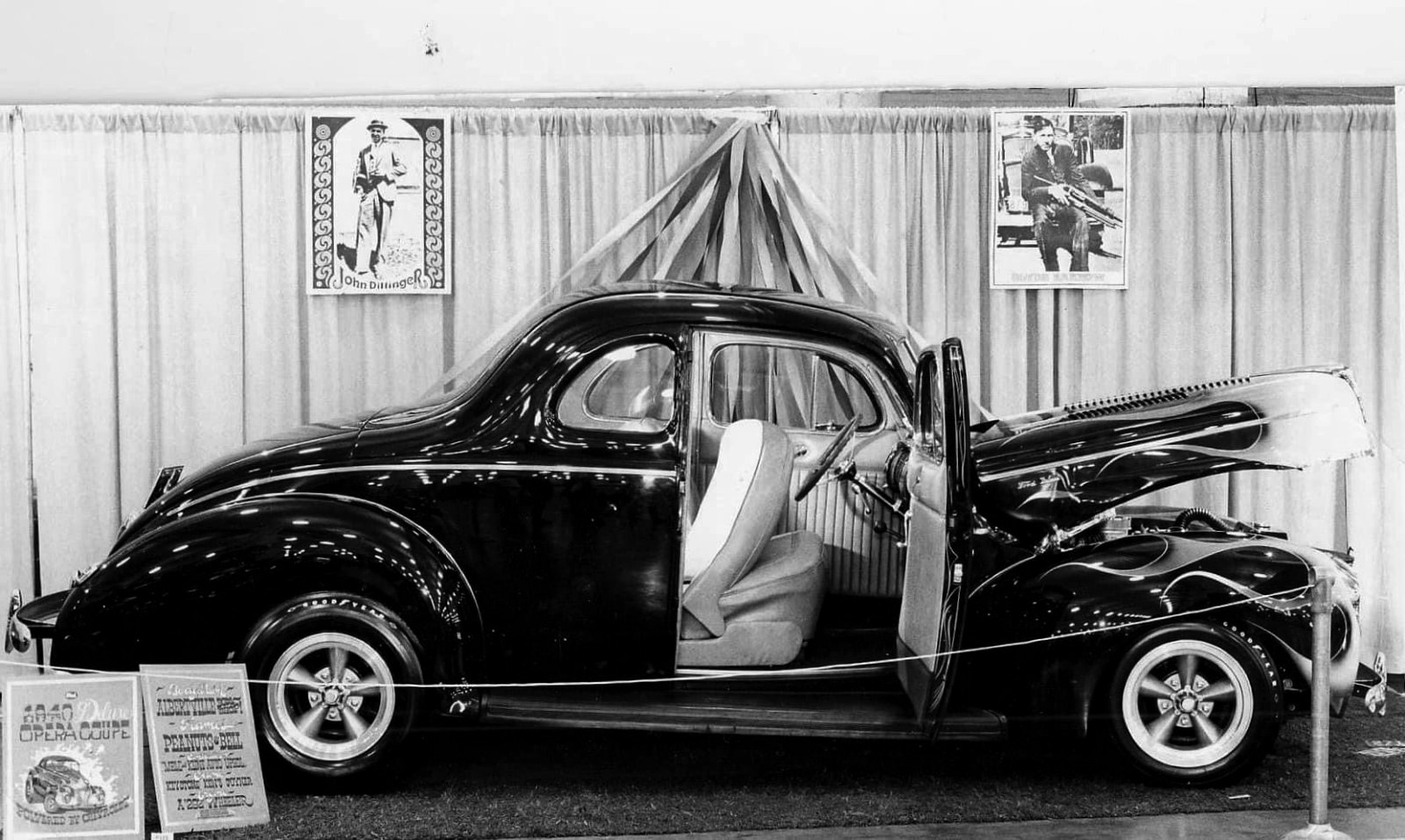 1940 Deluxe Coupe with Flames at a Show.jpeg