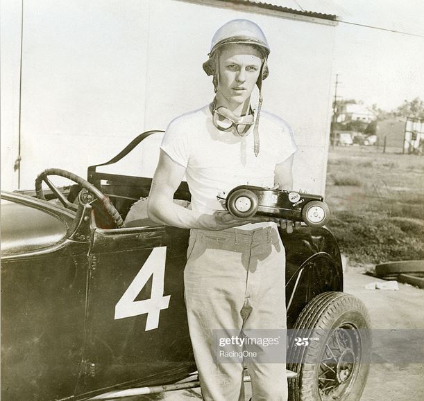 47 1946 Sixteen-year-old Troy Ruttman holds a model o.JPG