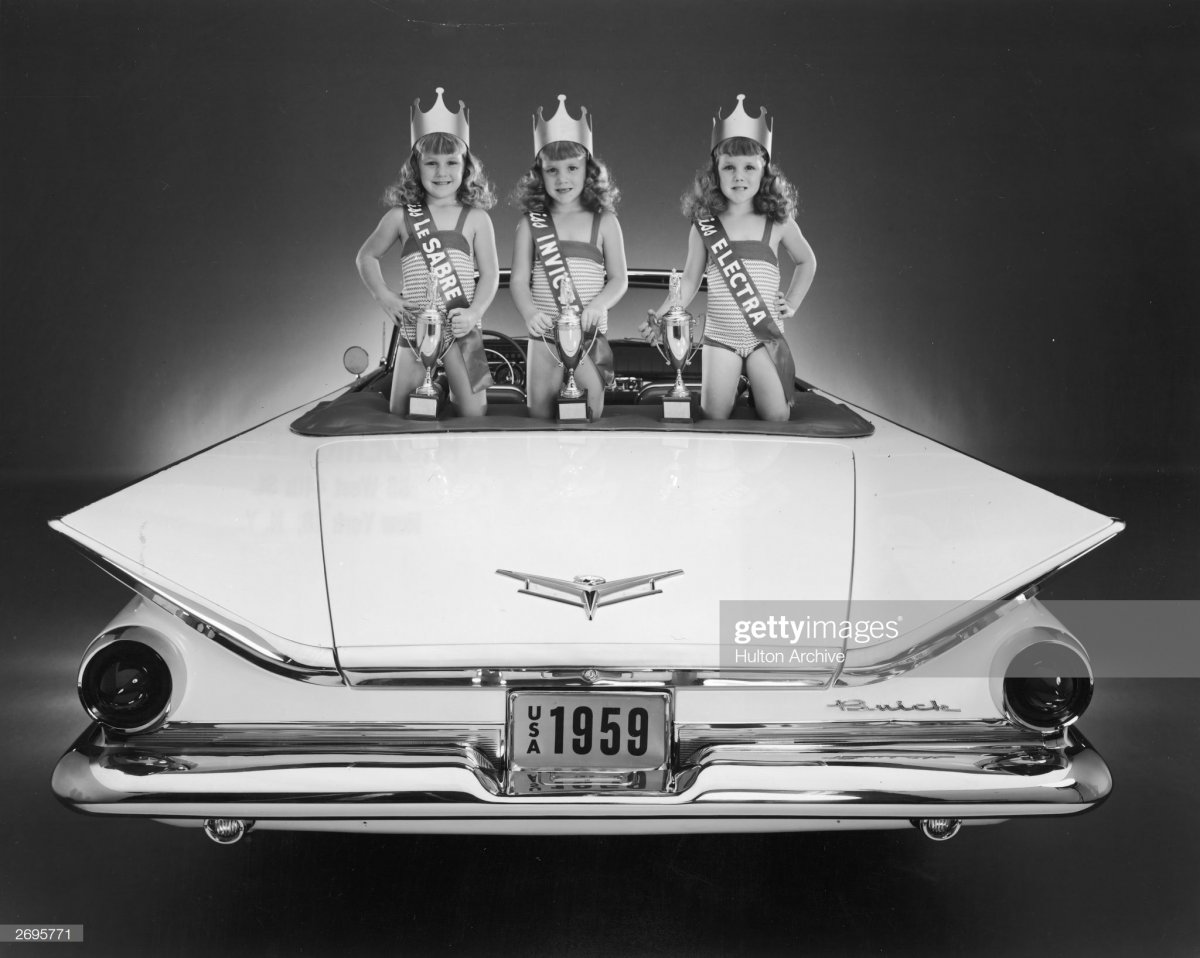 5 Three young girls pose in the back of a Bui.jpg