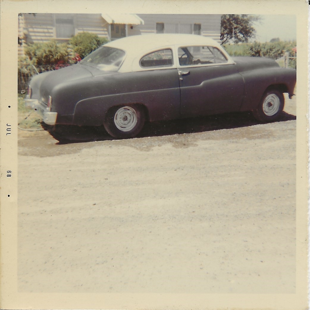 51 merc in front of house side .jpg