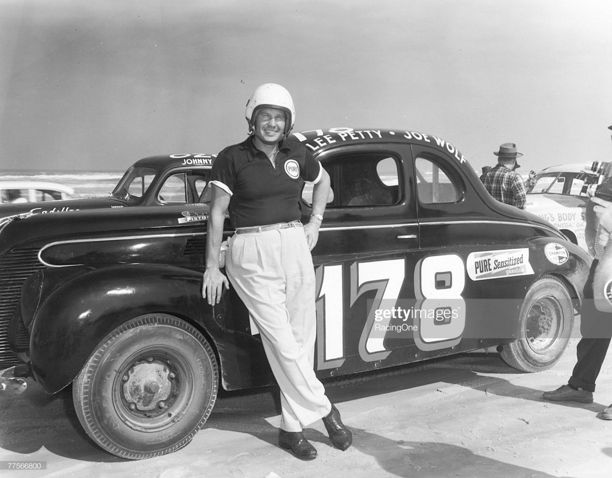 61 Lee Petty poses by his modified car on Daytona Beach, Florida on February 27, 1955.jpg