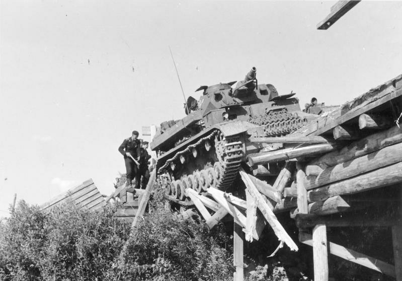 A German Tank almost falls off a Russian bridge on July 4, 1941..jpg