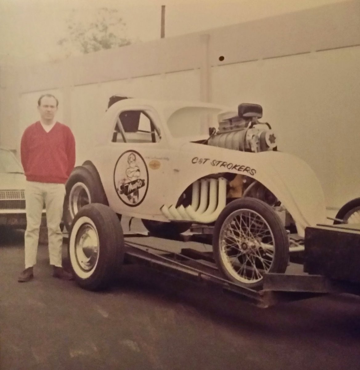 A newly found photo of Jim Miles standing next to the car..jpg