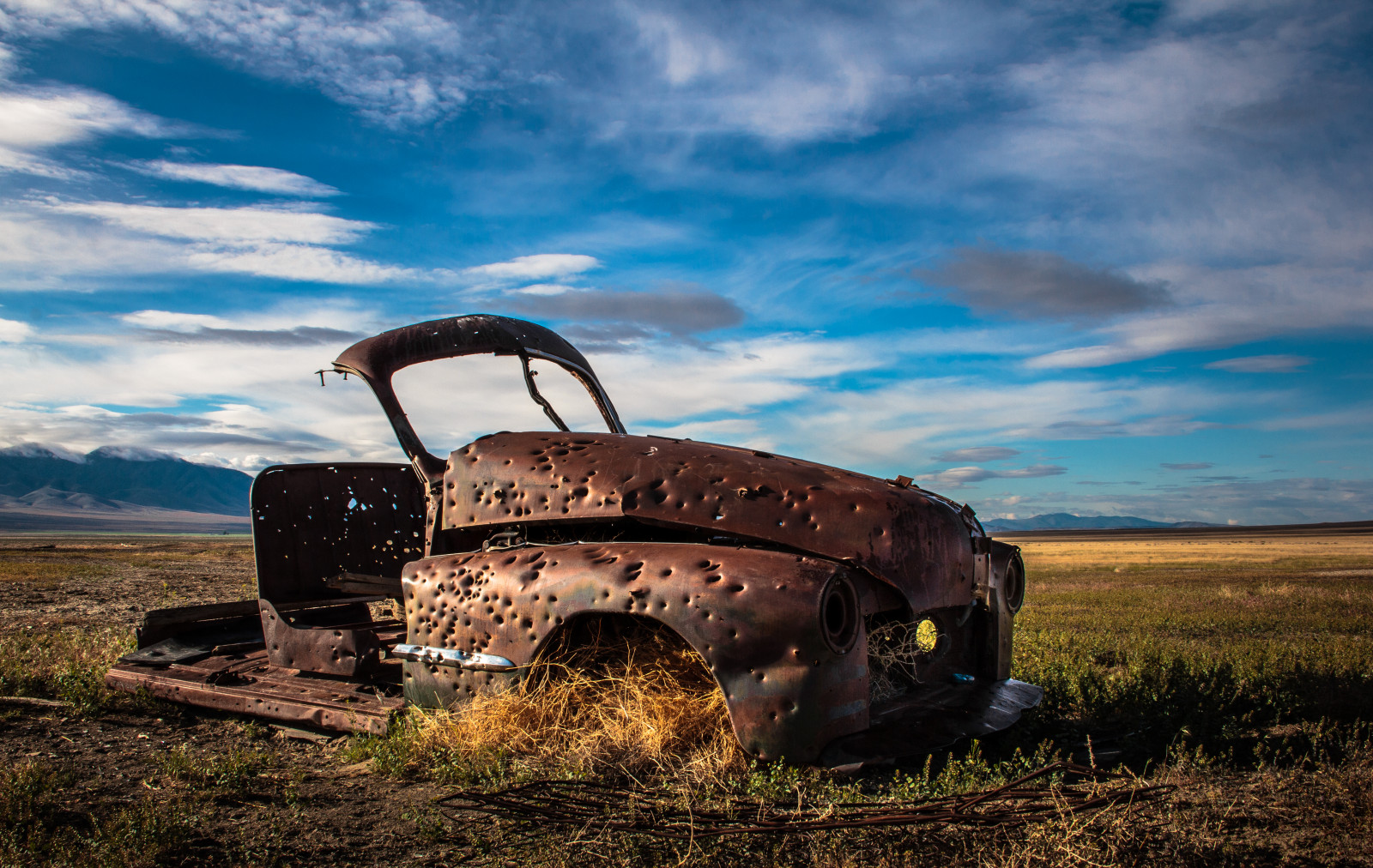 abandoned_car_skeleton_rust_shot_desert_decay_nevada-942615.jpg