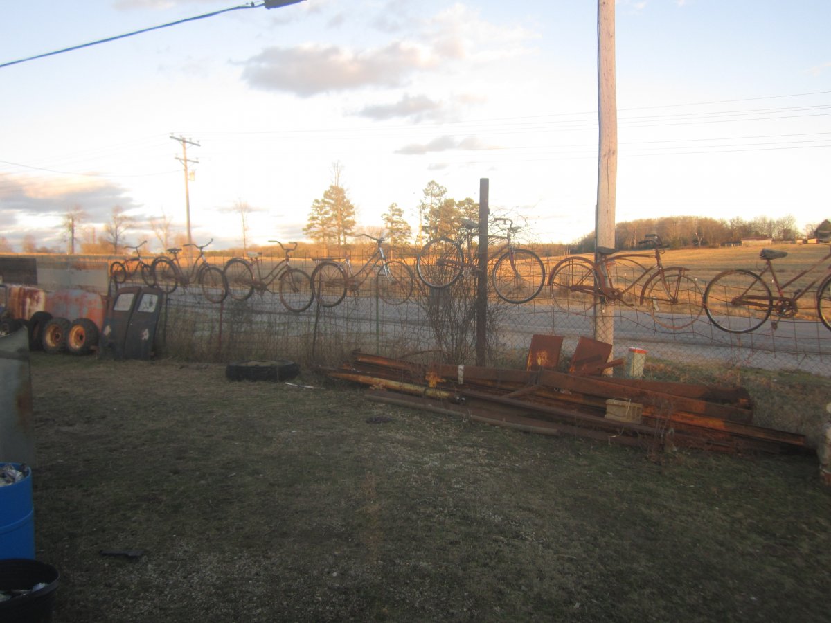 bikes on fence 004.JPG