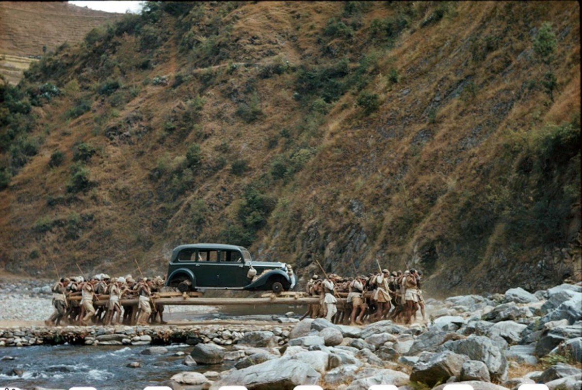 car on long poles across a stream in Nepal, 1948.jpg