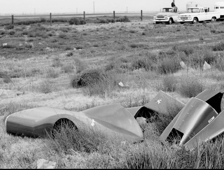 Dragster streamliner body parts out in the weeds.JPG