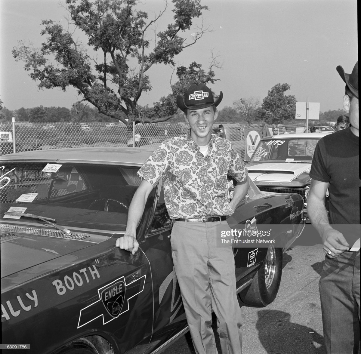 Driver Wally Booth next to his.jpg