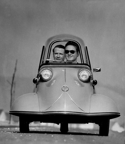 Front+shot+of+two+men+riding+in+the+three+wheeled+German+made+Messerschmidt_+1954.png