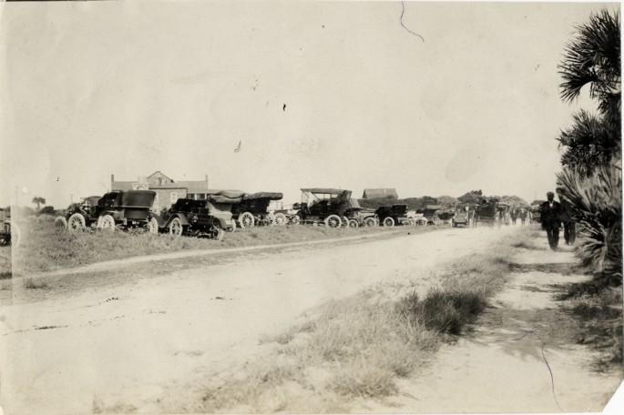 Here’s a row of cars lined up to watch the race cars run in 1908.jpg