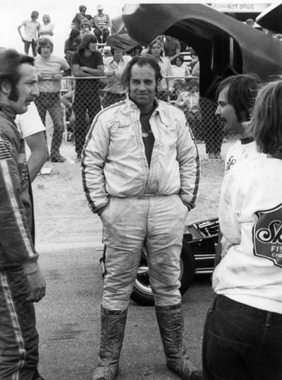 Jim  Dunn does a little bench racing with fellow racers and crew guys in the lanes before a run..jpg