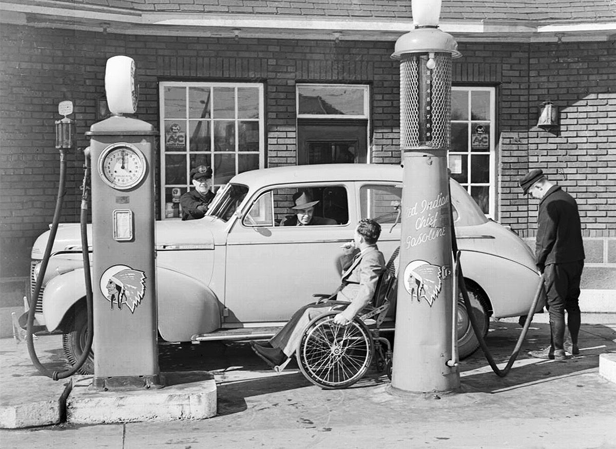 Jimmy Darou, paralyzed jockey, owned this service station, 1938b.jpg