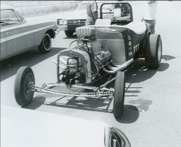 John Blackerby 394 Olds AA  and road.JPG