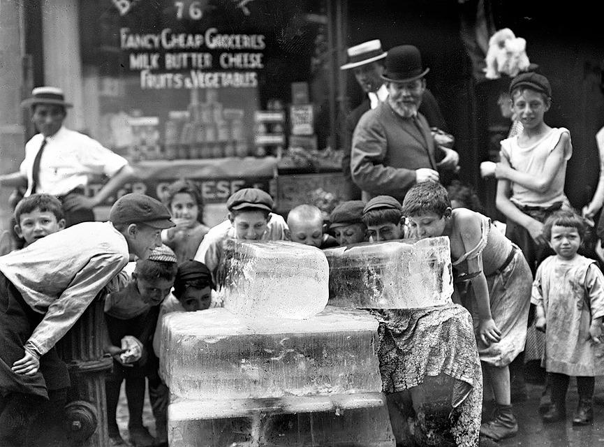 licking blocks of ice on a hot day 1911.jpg