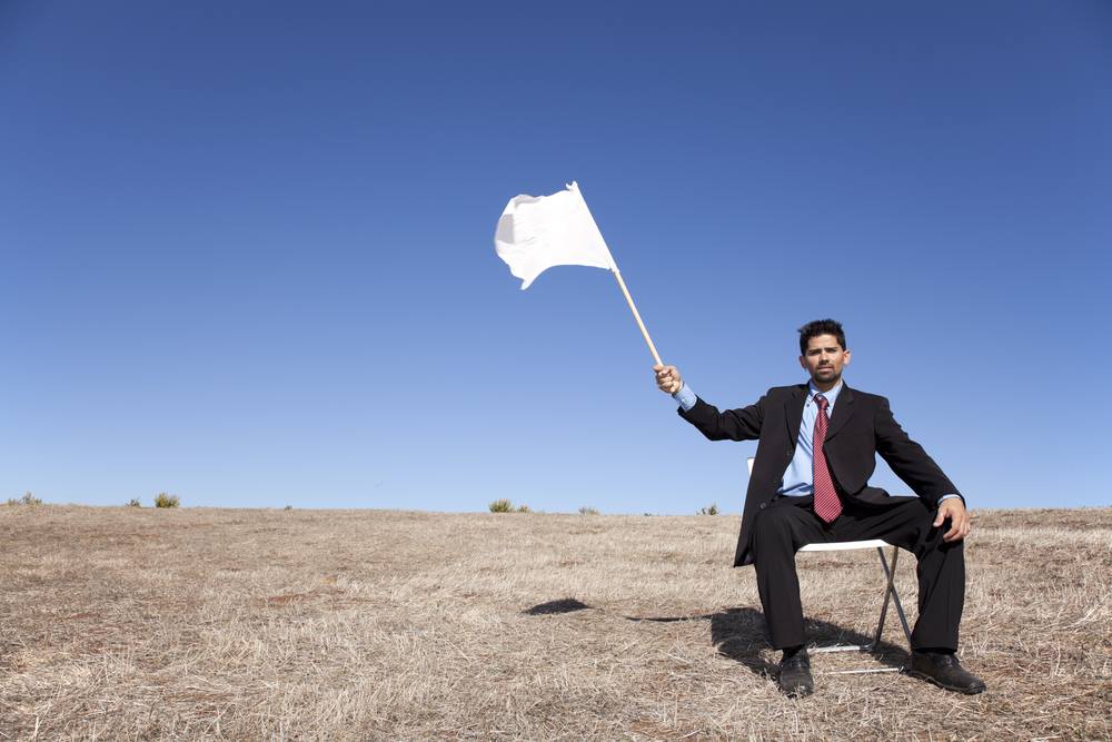 man-waving-white-flag.jpg