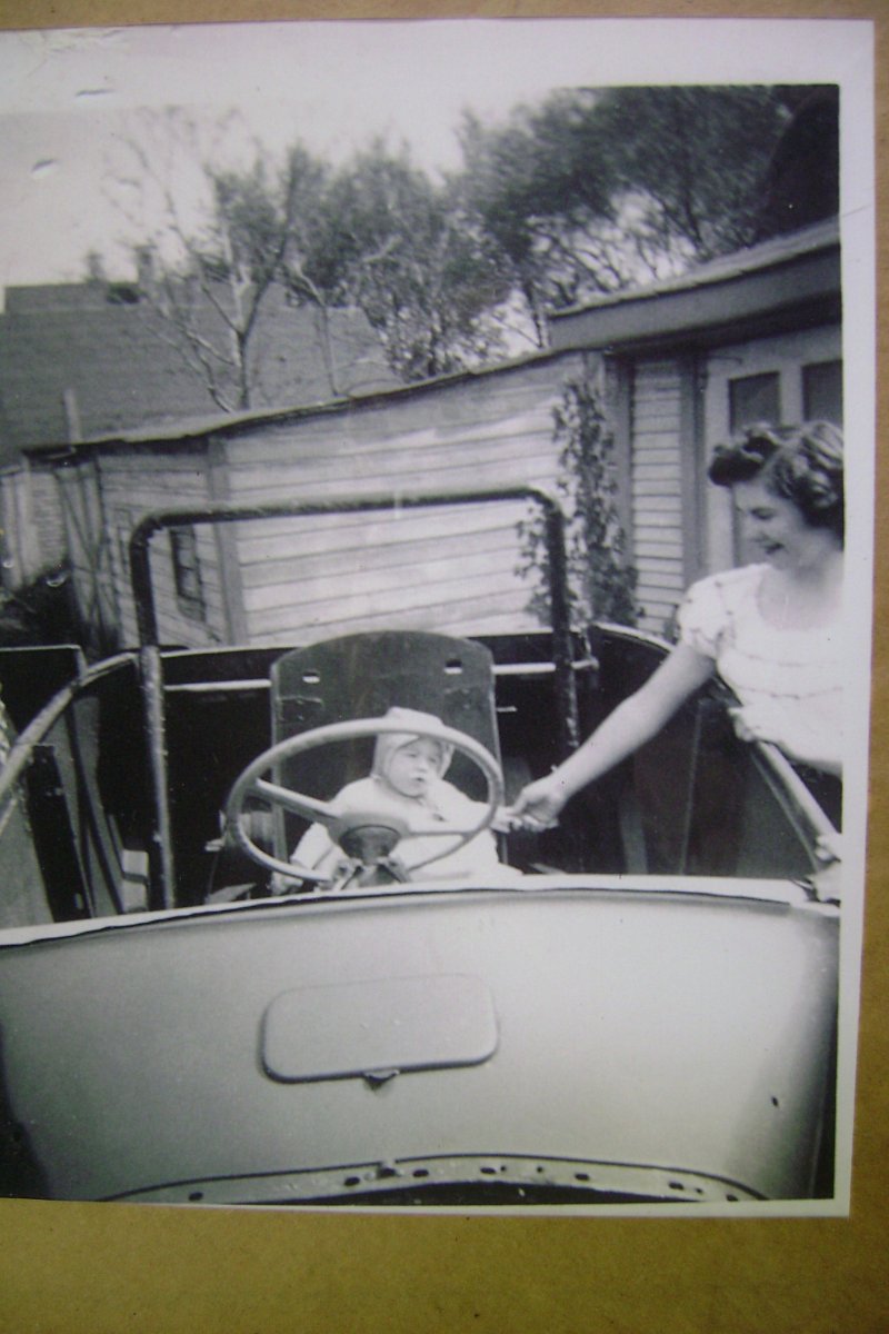 me & Mom in dad's track roadster 1950.jpg