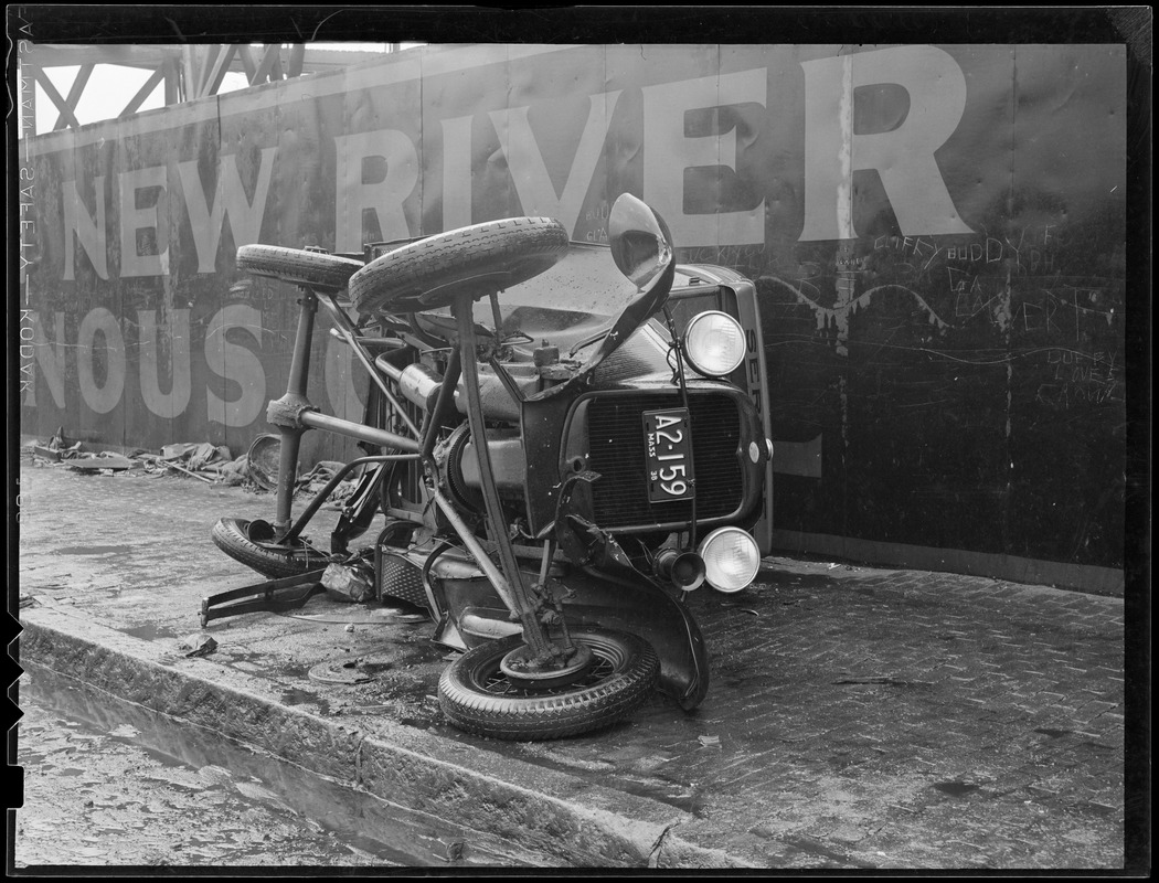 Overturned auto on sidewalk 1938 note ad for New River Bituminous Coal.jpg