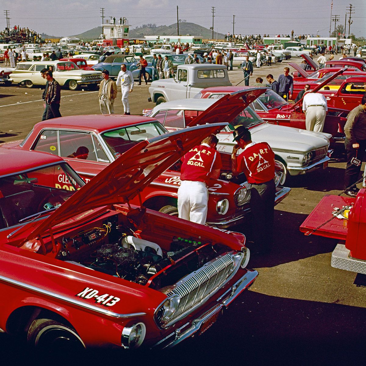 Racers work on a 1962 Dodge Dart in the pit at the NHRA Winternationals Drag Race..jpg