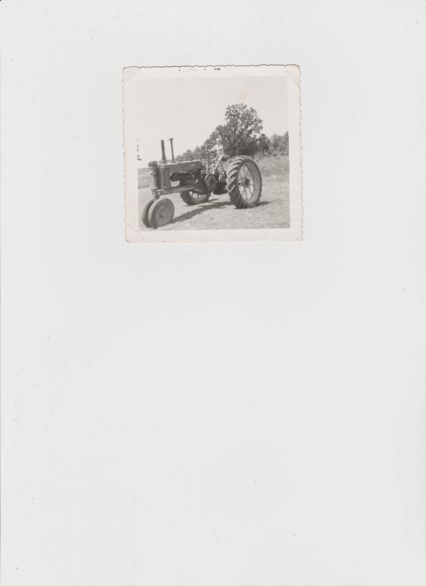 Randy driving tractor 1958.jpeg