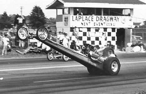 Ronnie Martin gets big air in the Holley & Venables Top Fuel Dragster. Photo by Dan Watley.jpg