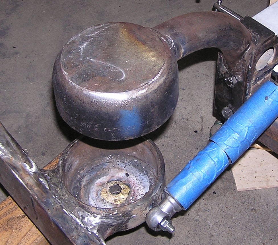 tie rod end bushing installed in spring cup.jpg