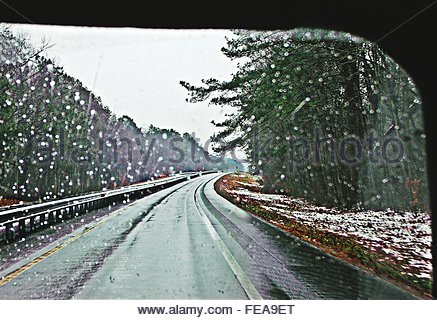 view-of-road-through-wet-windshield-fea9et.jpg