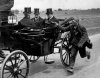 beggar beside king george coach 1920.jpg