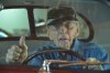 TOM BEHIND THE WHEEL OF HIS REBUILT 40 8-12.jpg