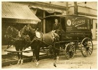 A team of horses pulls a Vernors Ginger Ale delivery wagon in this 1909 photo.JPG