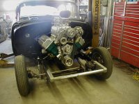 55 Chevy motor back in after painting firewall and floor.JPG