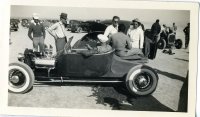 Ed Iskendarian in Roadster  Iskendarian script on vc - Harper Dry Lake 1941- sm EAE phto.jpg