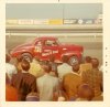 Studebaker red f side at track :crowd.jpg