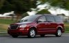 2008-chrysler-town-and-country-front-three-quarters-view-motion.jpg