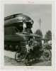 Railroads on Parade - Woman standing on train and man and woman on horseless carriage1.jpeg