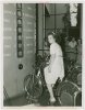 Standard Brands - Exhibits - Woman testing strength on electric bicycle exhibit.jpeg