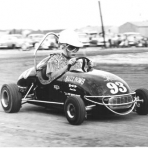 This was the first (prototype) Kurtis Kraft 1/4 midget. This picture was taken in Wichita, Kansas in '57. I won the first 1/4 midget national championship in the AA/Open Fuel class with this car at Blakely Stadium in Phoenix, Arizona in December '57. I was 12 years old. Currently owned by Doug Schiller and is in the Justice Bros. racing museum in Duarte, Ca.