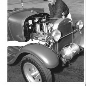 Checking the plugs after a run @ Pomona early '63. Photo by Kaye Trapp.