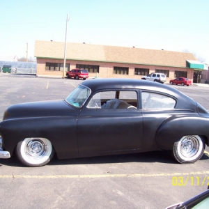 After removing a TON of bondo slathered all over by the guy who originally restored it, the local high school used it for practice and shaved it and coated it in some semigloss paint. Not the final plan, but at least it's one color.