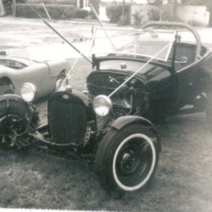 My high school rod {1959,getting some new paint in 1962]
In 1965 sold off some of the body parts of this rod to get stuff for our new home and wife. I took out and used my 292 Y-block v8 in our Staionwagon and had put the rest away in back of garage for many years.
Now 2007,I'm working on getting this back together with some limited updates.