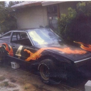 Airbrush dragon and some flames with stripped outline on one of my Toyota racers. This toy was very new when made into a racer from a wrecked car.
Note the flame colors are always going from dark to light so they show far better on the race track to the fans in the stands. Best year was 18 mainevent wins in one year with this car,was named "Black Magic"