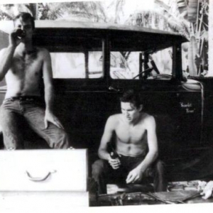 Photo from 1964,got printed in 65. Steve's rod [he's seated,I'm leaning on it,we just finished some tuning work on his Y-block,was no AC shops then,we were lucky we had a carport.
Note the big tool box,well it was for then.
I had painted name on his rod and the striping a few years before. "Scarlet Fever" was red with white trim