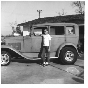 Jack & Maryann.
Jack and his buddies "borrowed the Halibrands off my roadster, and the 37 Chevy headlight air scoop I made for the dual AFB's on my 57 Chevy, for a "photo session". 1963, Jack was 12 years old. Note the requisite surf decals on the quarter window.