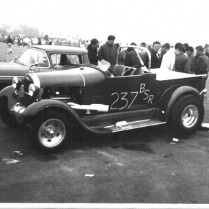 Winternationals 1963. I didn't know this picture exsisted until just recently. We had just destroyed the quick change, and the day was about to get real busy. Less than 5 hours later we had replaced the center section, and were in line for eliminations. We won class and re set both ends of the national record.