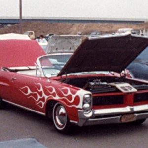 One of several primer jobs over the years. This one was 70 Chevy red laquer (to seal the primer below and keep it from rusting), unbuffed, with Krylon flames. Satin paint 20 years before it was cool! :)