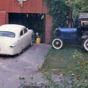 The Eggmobile and cut down Ford tractor which I used to plow snow from the driveway and yes there is an old hot rod stufferd in the garage