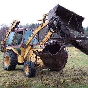 lifting the boom off the machine with help from my dad